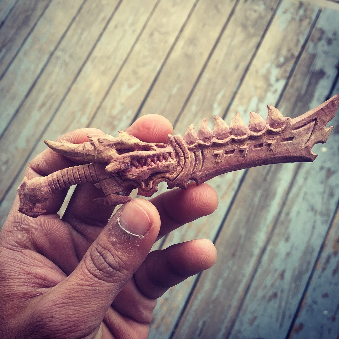 wood carving dragon sword